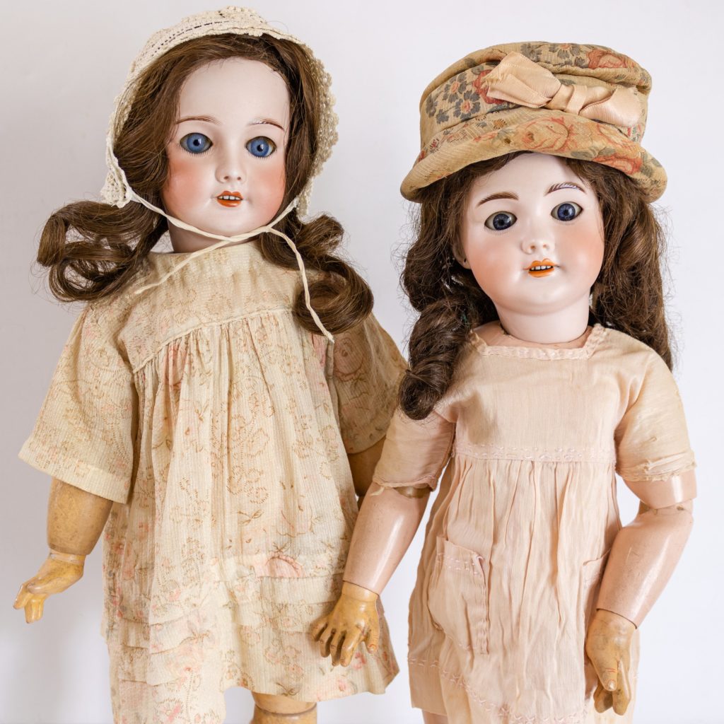 Two SFBJ 301 Paris Dolls with Jumeau oval paper labels on the doll bodies.