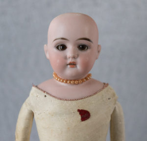 antique Edmund Ulrich Steiner Doll with kid leather body and half the red paper label and original beaded necklace found at estate sale in Kershaw, SC