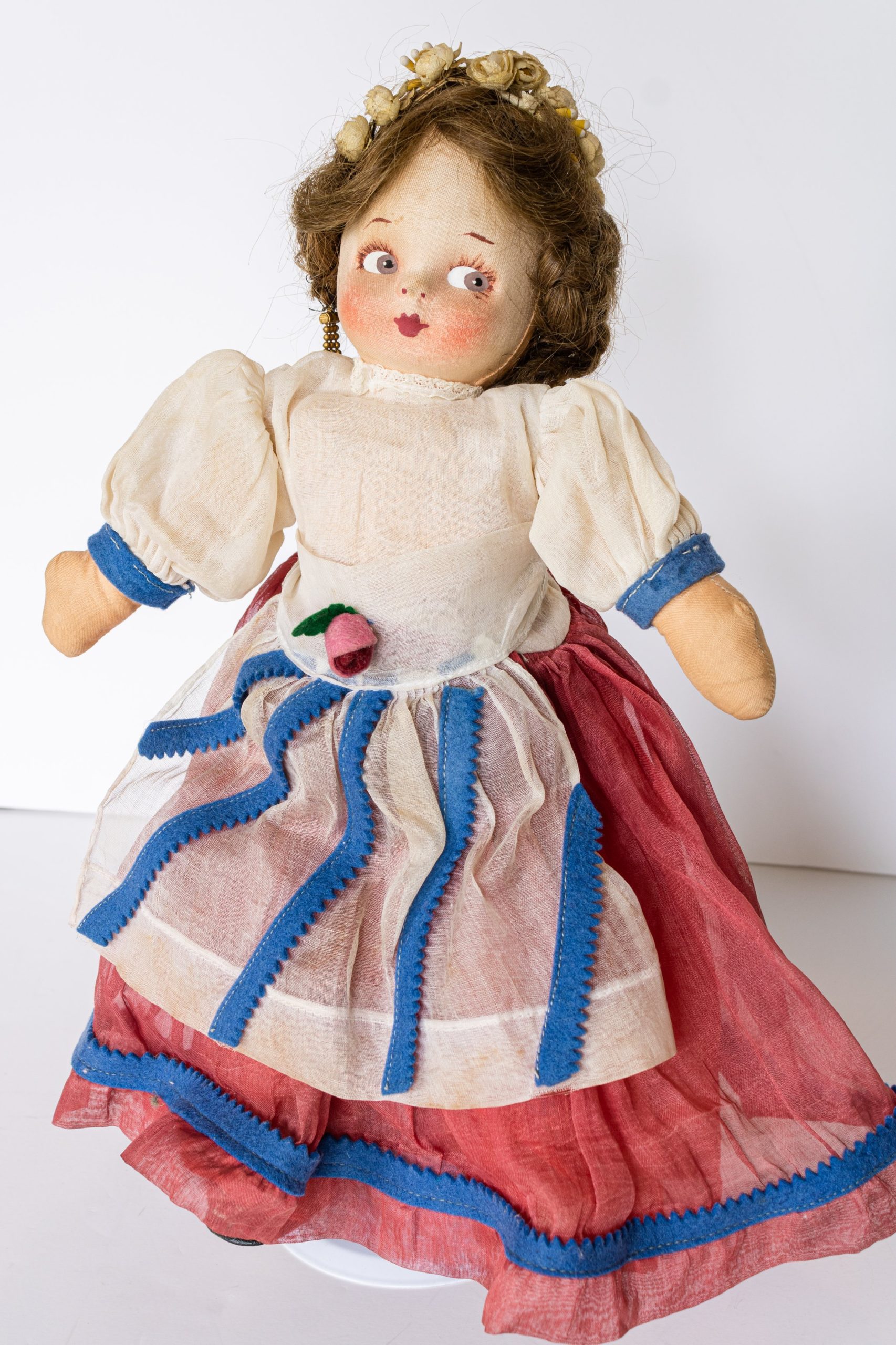 Vintage Molly'es Cloth Doll with mask type face with pressed and painted features, human hair wig and cotton organdy dress.