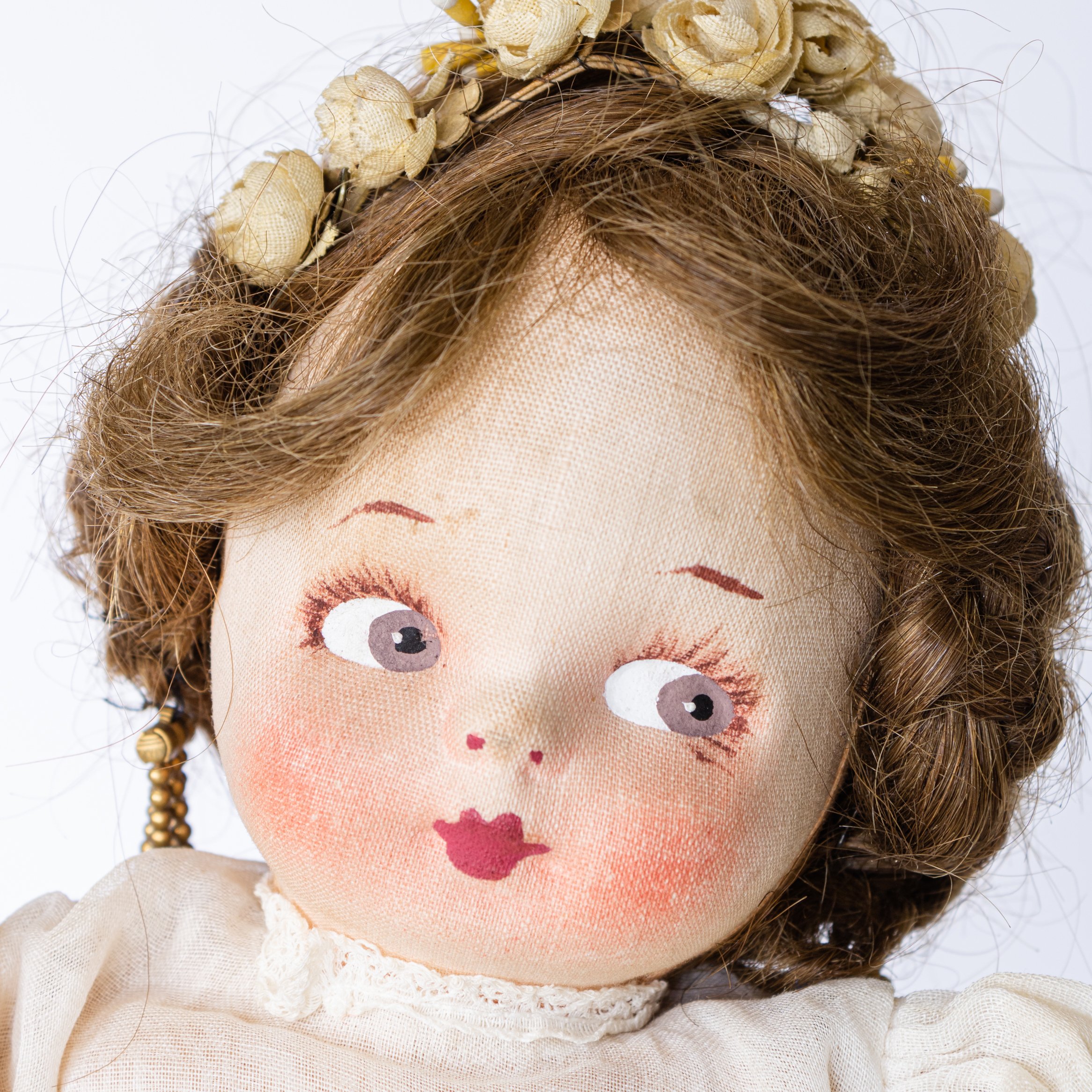 Vintage cloth doll made by Mollye Goldman of Molly'es Outfitters or Molly'es International Doll Company probably in the 1930s with pressed and painted facial features.