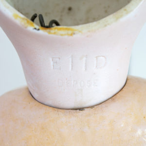 The back of an antique french bisque head doll is marked E11D Depose for Etienne Denamur.