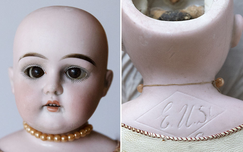 Antique bisque shoulder head doll marked E.U.St inside a diamond