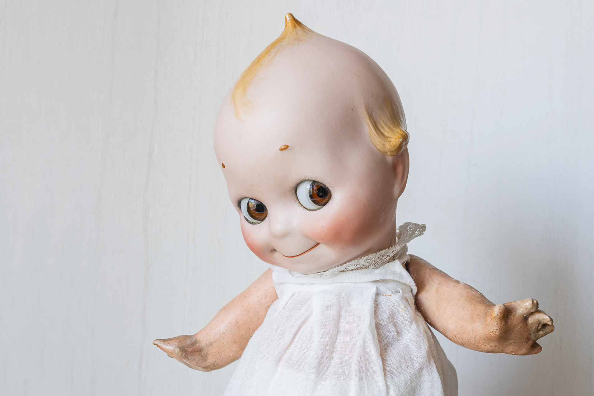 Kewpie doll with composition jointed body and bisque head made by J.D. Kestner