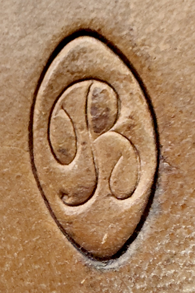 The B incised mark on the bottom of a French leather doll shoe for Bru Jeune et Cie