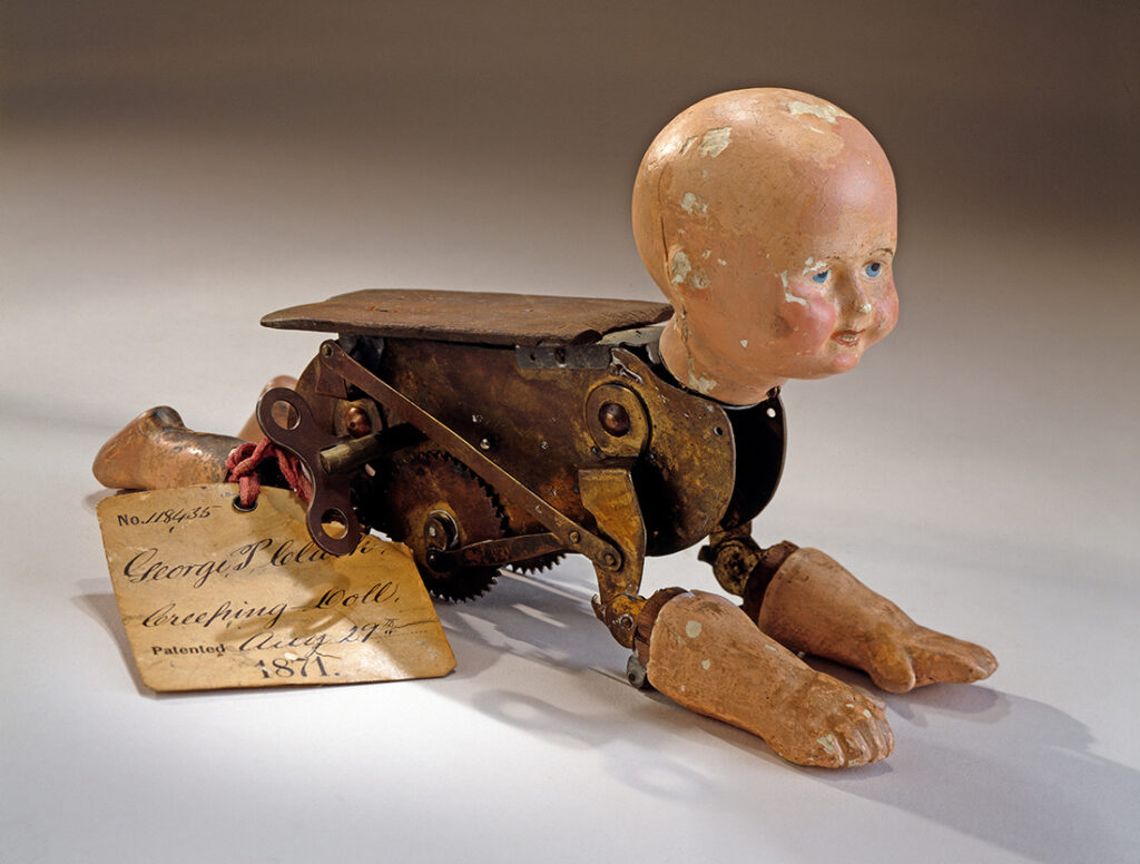 This doll represents the antique american doll patent from 1871 by George Clarke. This patent model is from the Smithsonian Institute.